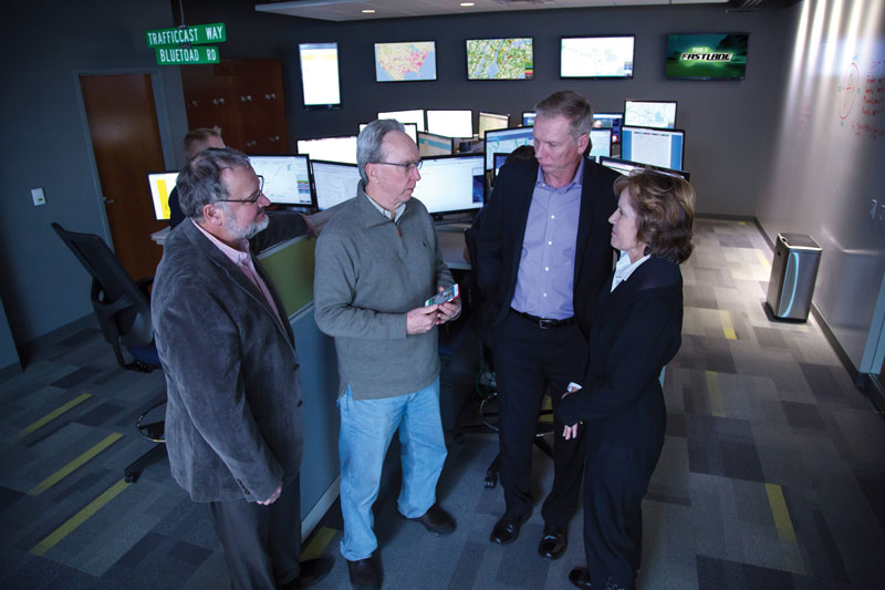 TrafficCast’s operations center monitors cities across the nation. Meeting are (left to right) Nick Kiernan, TrafficCast Executive Vice President of Sales/Business Development; John Drury, MGE's Senior Business Development Manager; and Lorrie Heinemann, President of Madison Development Corp.