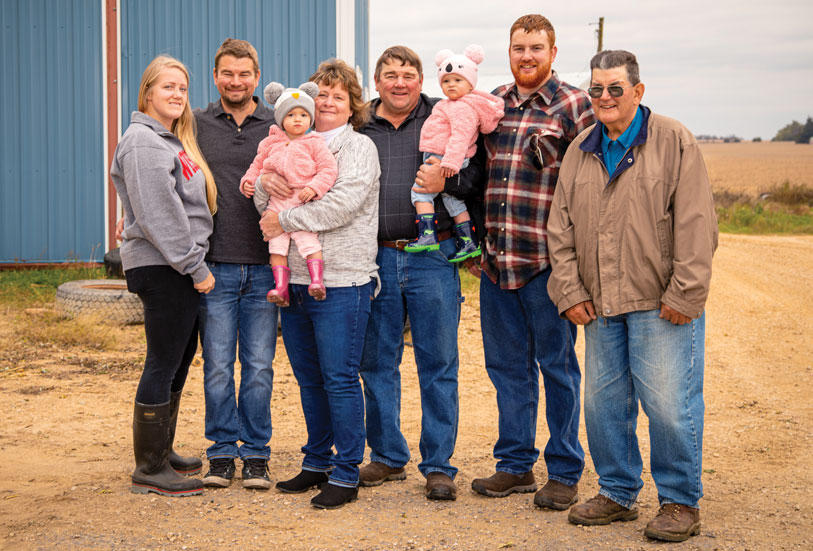 Brad Bishop (far right) is leasing part of his family’s farm to the 300-MW Badger Hollow Solar Farm in Iowa County, Wis.