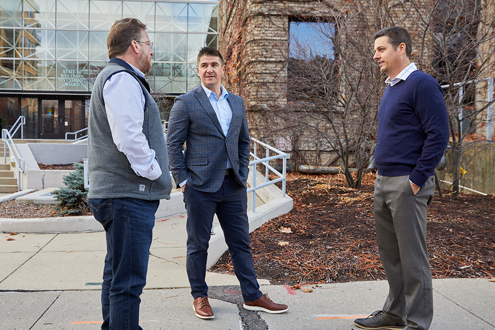 Quad Capital Partners Vice President Dan Kennelly (right) is one of the first developers to work with MGE’s Business Design Assistance Team, which includes Manager Service and Gas Engineering Steve Beversdorf and Economic Development Manager Brad Alexejun (pictured from left to right).