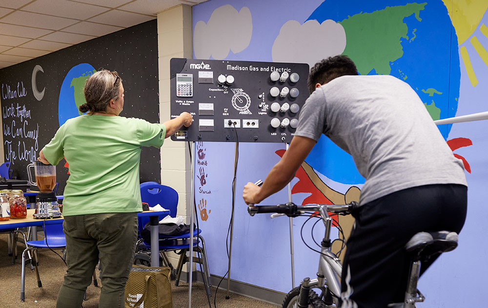 Leah Samson leads the Pedal Power bicycle program with a student