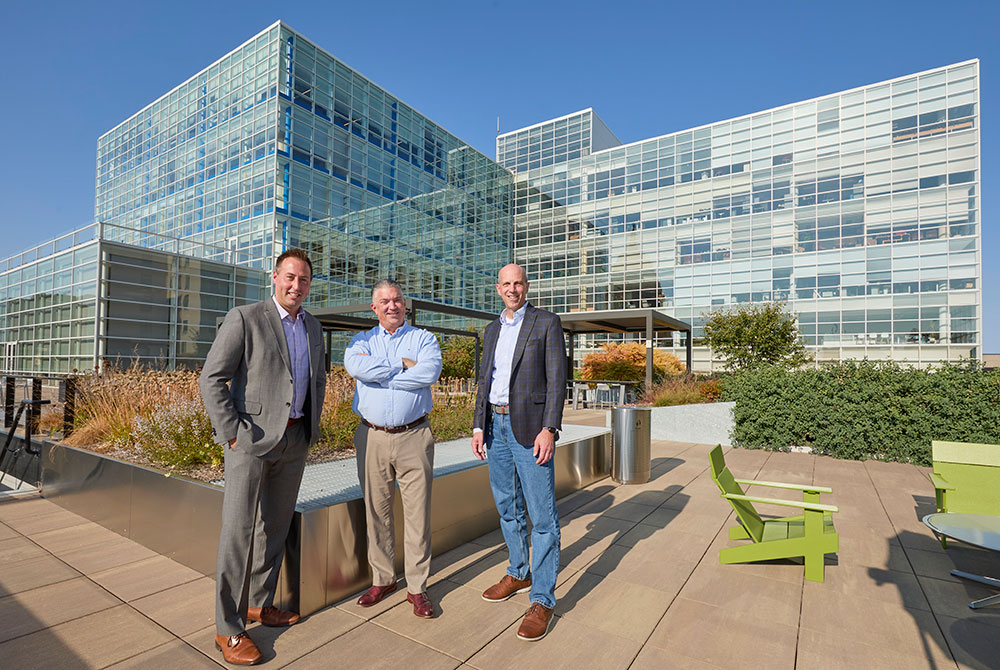 MGE’s Matt Matenaer (left), Senior Engineer Business Customer Relations, with Mead Bradley and Robert Bruni of Urban Land Interests (ULI)