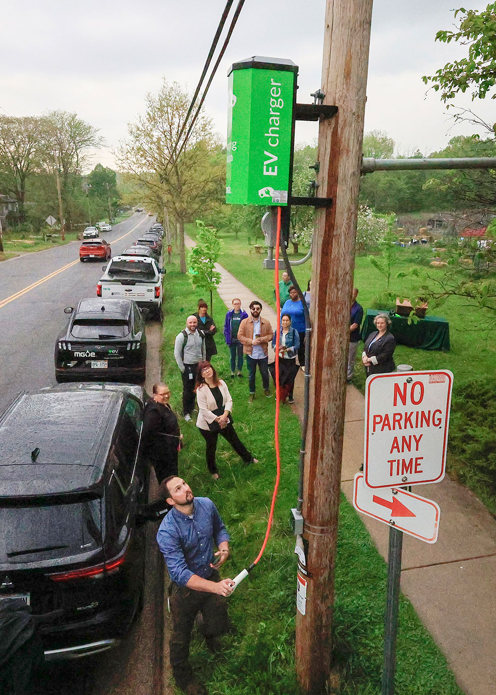 Ribbon-cutting event for MGE's new pole-mounted EV charging stations